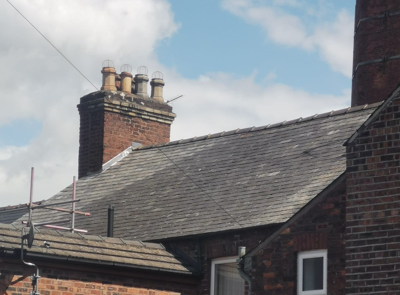 A roof worked on by Stuart, with Dixon's Chimney visible in the background.